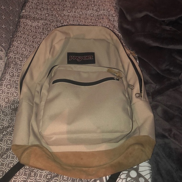 beige jansport backpack